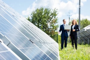 Two people at solar power plant