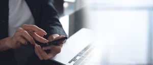 close-up-business-woman-hand-using-mobile-phone-working-laptop-computer-office-woman-using-smartphone-online-shopping-surfing-internet-social-media-marketing